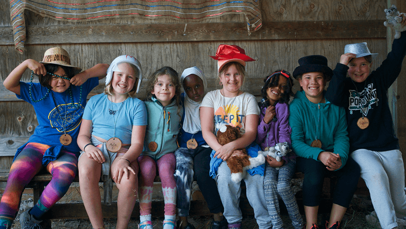 Kids gathered and smiling