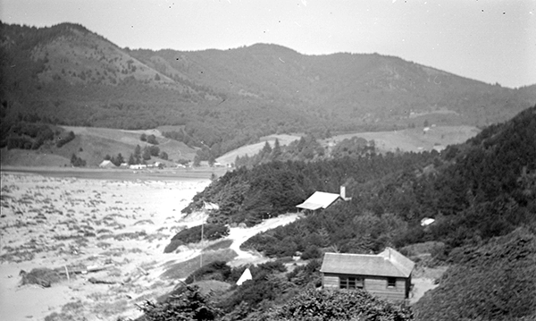 A historical photo of camp westwind cabins with views of the coast