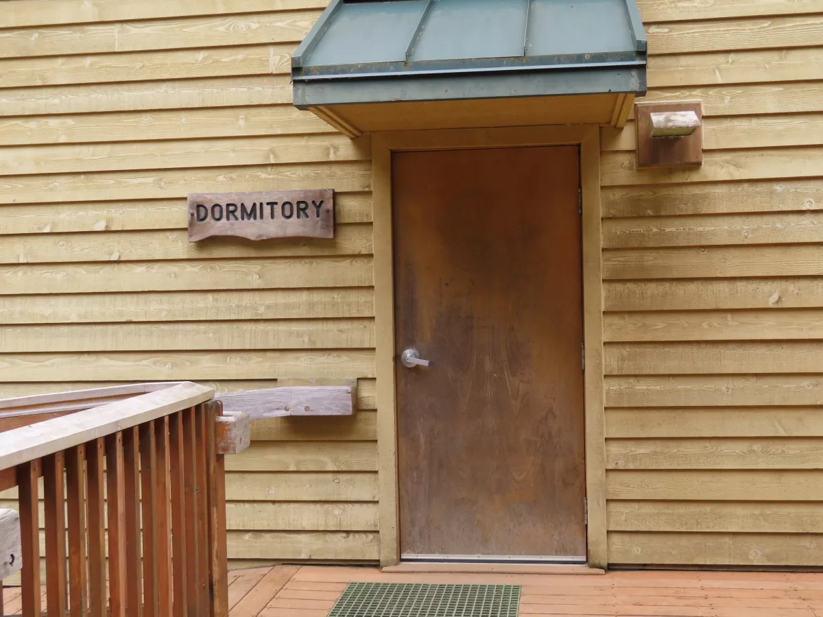 Wooden door to dormitory