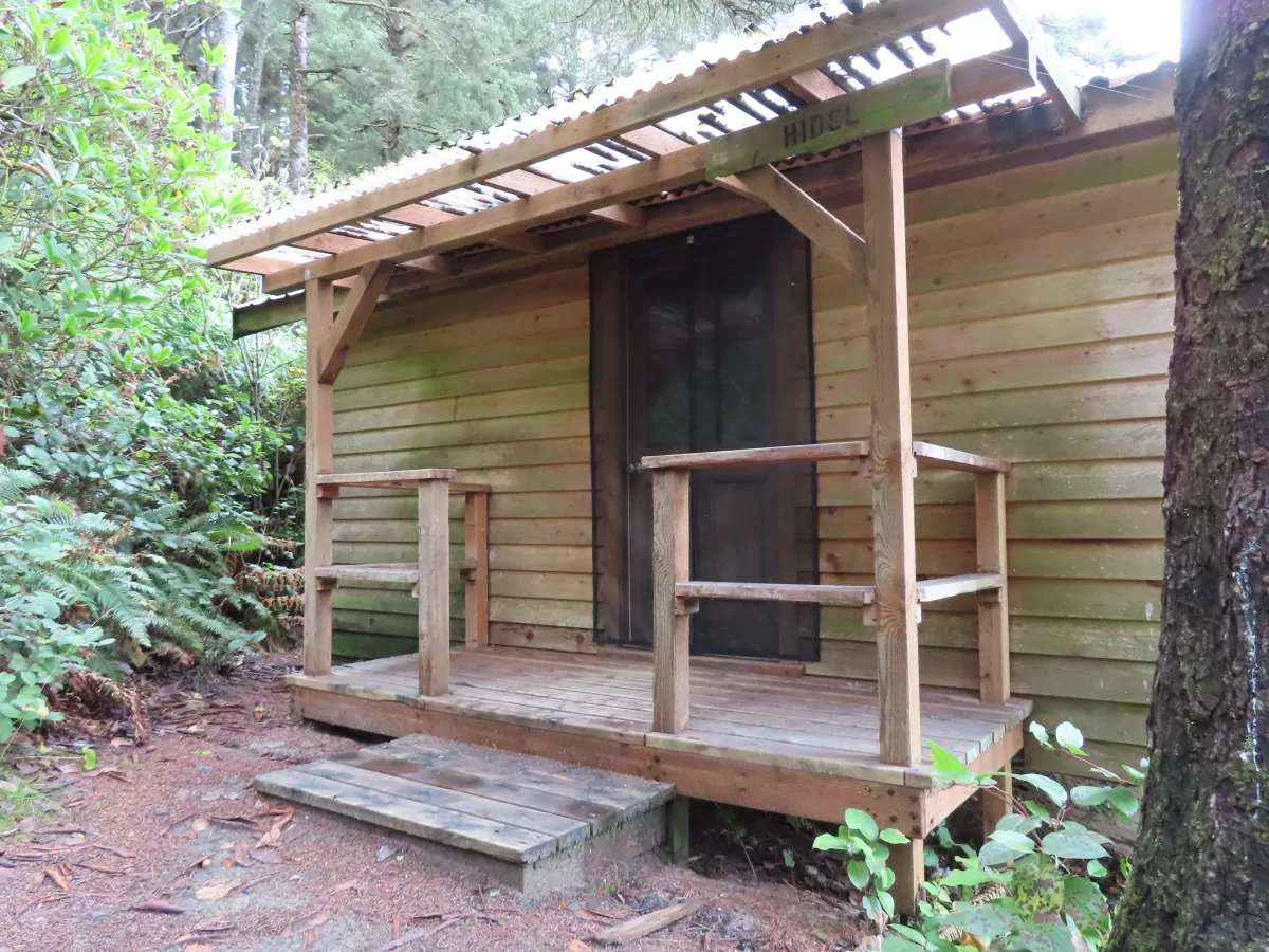 Wooden cabin with covered wooden porch