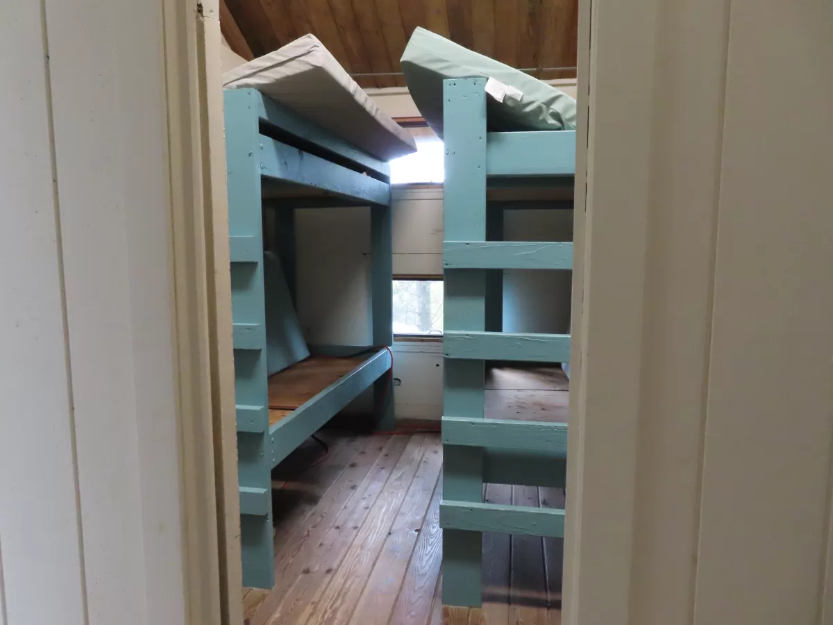 Two bunk beds in small room