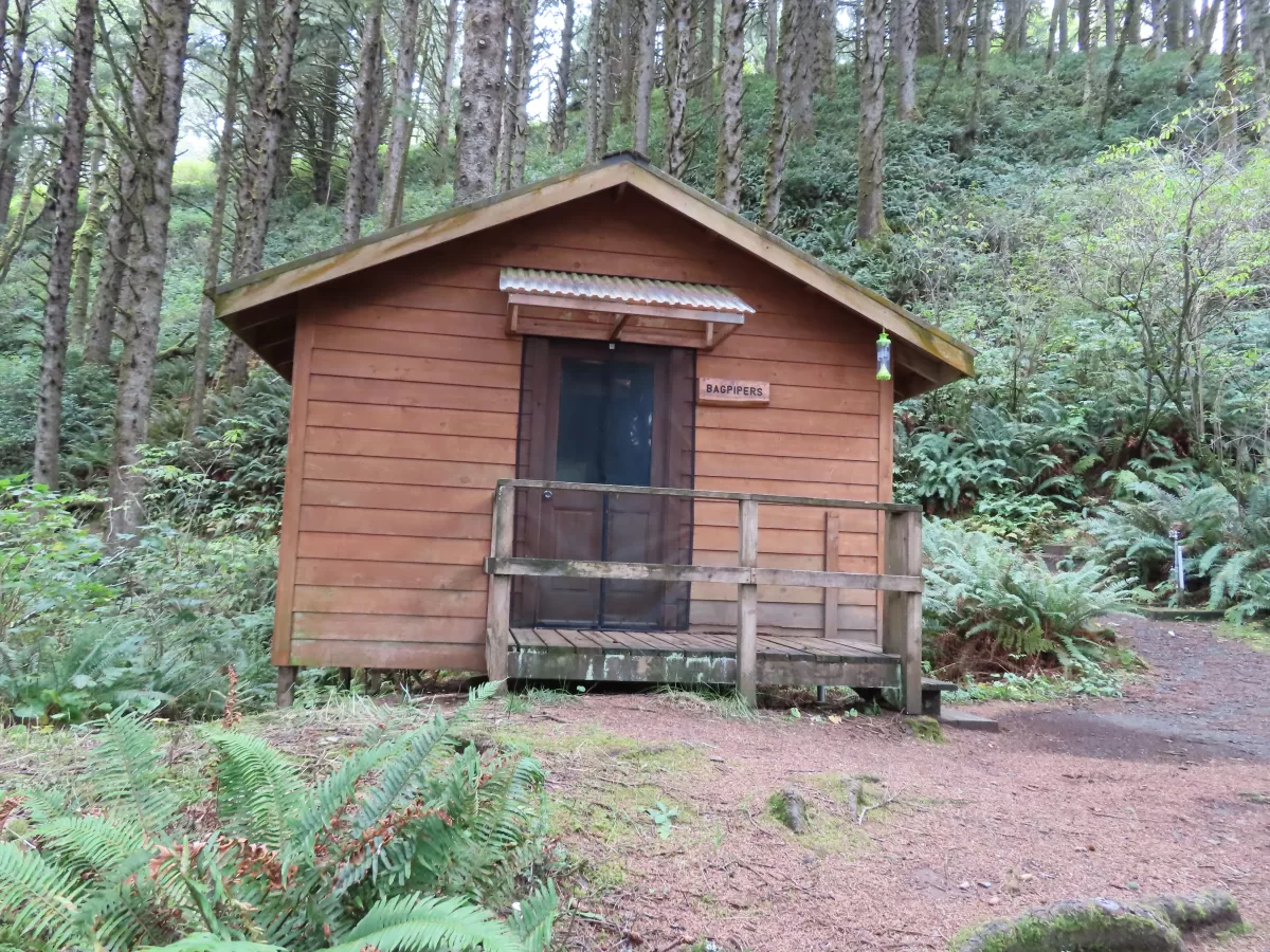 wooden cabin with small wooden deck