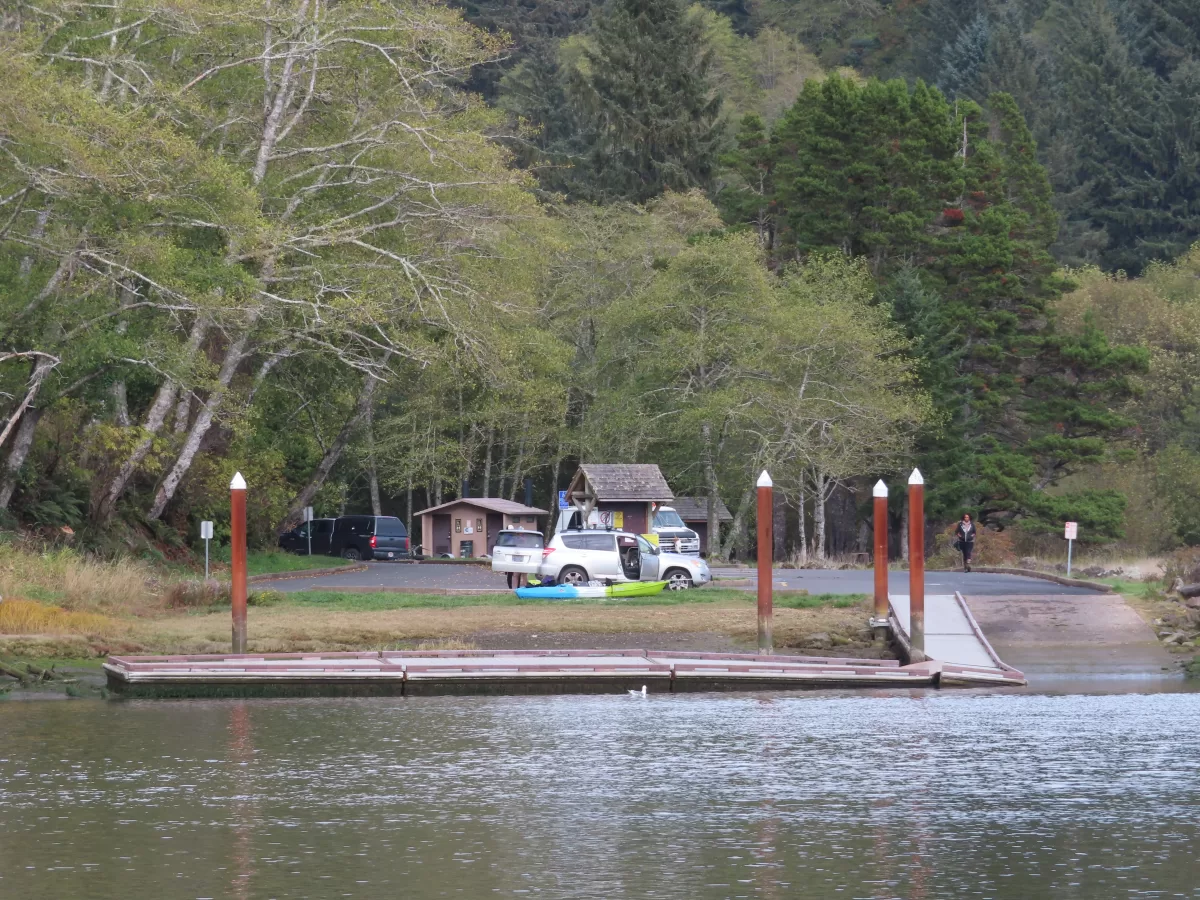 Floating dock with parking lot behind.