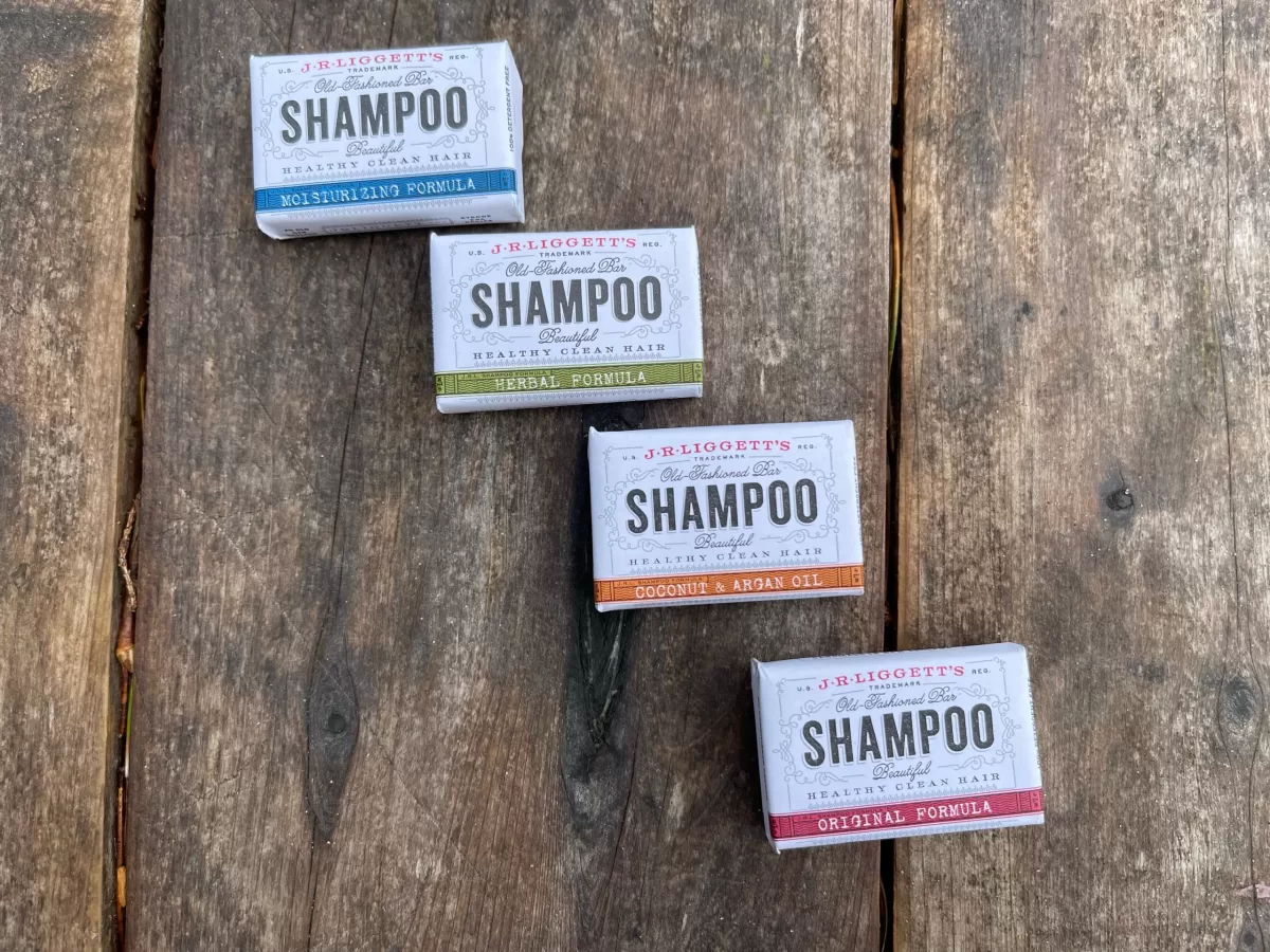 four paper wrapped bars of shampoo